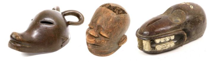 A Makonde Wood Helmet Mask, Mozambique, the skull set with cropped human hair, with scarifications