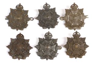 Six First World War Officer's Cap Badges to the Border Regiment, in bronze, four with twin lug