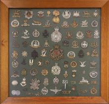 A Collection of Eighty British George VI and Elizabeth II Regimental Badges, including two helmet