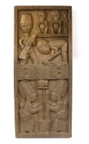 A Yoruba Wood Door Panel, Nigeria, of double panelled rectangular form, the upper panel carved