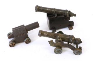 An Early 19th Century Bronze Small Signal Cannon, the 14.5cm triple ringed barrel with scroll to the