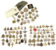 A Collection of Approximately One Hundred Military Cap, Collar and Other Badges, including some