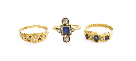 An 18 Carat Gold Sapphire and Diamond Five Stone Ring, three oval cut sapphires spaced by old cut