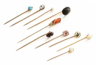 Ten Stickpins, including a coral and turquoise snake example, a garnet and split pearl example, a