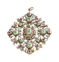 A Ruby and Emerald Pendant, the square step cut emerald within a border of oval cut rubies, in white