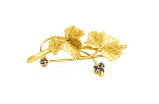 An 18 Carat Gold Sapphire Leaf Brooch, length 3.9cm Gross weight 4.8 grams.