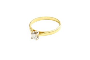 An 18 Carat Gold Diamond Solitaire Ring, the round brilliant cut diamond in a white four claw