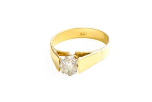 A Diamond Solitaire Ring, the round brilliant cut diamond in a white claw setting, to a yellow