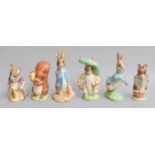 Royal Doulton Beswick 'Hunca Munca Sweeping' and 'Squirrel Nutkin', a pair of large gold edition