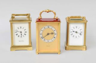 Three Brass Carriage Timepieces, a modern brass carriage timepiece, with white enamel dial, signed