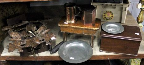 A German Cuckoo Clock, two pewter dishes, a small stool, a copper caddy and tankard, and a small