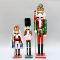 Three Gisela Graham, London, Soldier Form Christmas Decorations, one holding a countdown calendar,