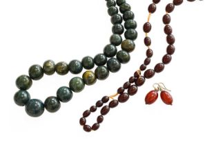 A Hardstone Necklace, the necklace of green graduated hardstones, length 93cm; Loose Amber Beads, of