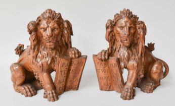 A Pair of Late 18th Century/ Early 19th Century Carved Lions, 25cm high One example lacking tail.