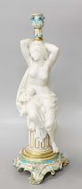 A Minton Parian Ware Figural Candlestick, 43cm high Two feet restored. An element is broken off