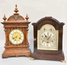 A German Oak Cased Striking Mantel Clock, signed Junghans, 50cm high, together with a German chiming