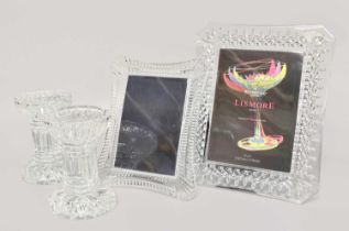 Three Waterford Crystal Picture Frames, together with a pair of Waterford candle stands (one tray)