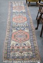 Berber Moroccan Runner, the compartmentalised field with a column of stepped coral pink medallions