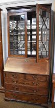 A George III Inlaid Mahogany Bureau Bookcase, with astragal glazed top section, later mirrored and