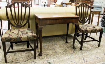 A George II Mahogany Foldover Tea Table, and A Pair of George III Dining Chairs (3)