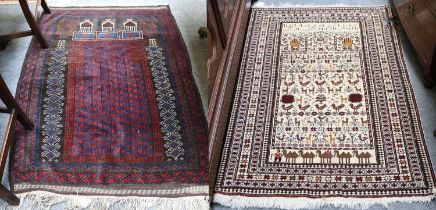 Rare Baluch Prayer Rug, the field with tribal and zoomorphic devices beneath a Mihrab and an