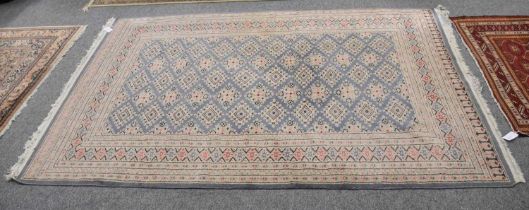 "Bukhara" Rug, the steel blue diamond lattice field enclosed by multiple borders, 240cm by 161cm;