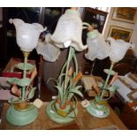 Set of three lily shaped table lamps with glass shades