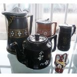 Three Victorian black glazed pottery jugs, similar tea pot and small slipware pot