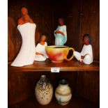 Contemporary group of four Mexican pottery figures of women and a similar cup, together with a