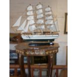 Spanish inlaid musical table and a model sailing ship