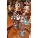 Pair of tall Art Nouveau - style two branch figural spelter table lamps (damage to one shade), 30"