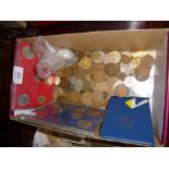 Box of old coins, some boxed currency sets, sports fob medals, etc.