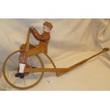 Vintage Folk Art painted wood push along toy cycling man