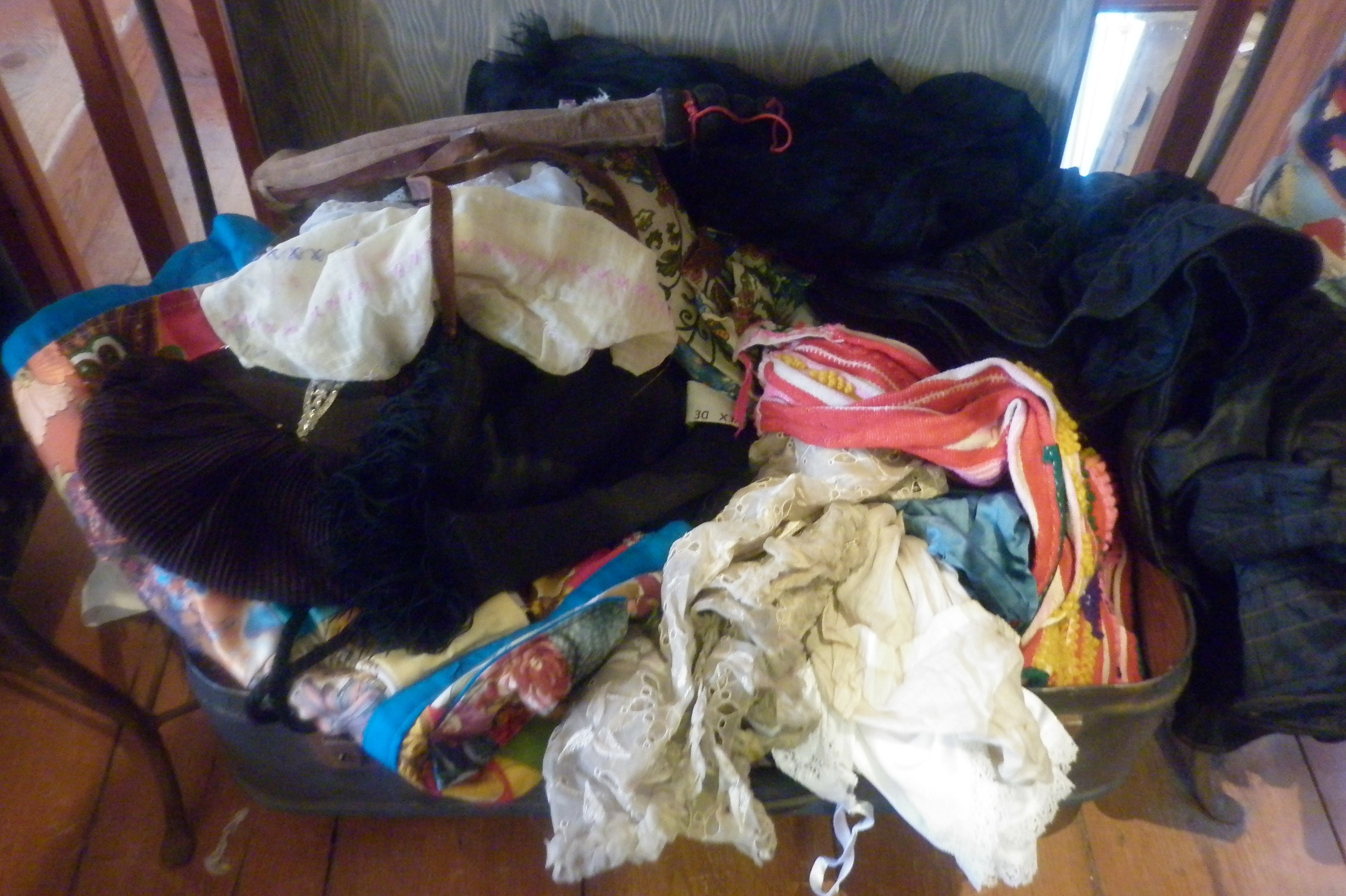 Suitcase of assorted vintage clothing etc