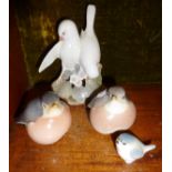 Four Royal Copenhagen bird figurines, white bird group (A/F)