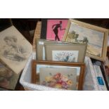 Eight various paintings and prints in a wicker hamper