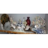 Large collection of assorted porcelain figurines including two Chinese pottery figures, lamp