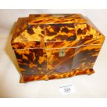 English Regency tortoiseshell double compartment tea caddy with pagoda top and standing on ball