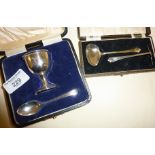 Hallmarked silver cased egg cup and spoon, and cased silver spoon and pusher