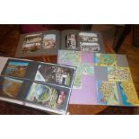 Three albums containing vintage postcards, and a scrap book