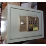 A Challenge digital home safe with instructions and spare parts