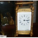 19th c. gilt brass carriage clock having four column body (crack to glass) with leather case and