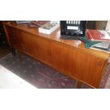 Mid-century teak sideboard with label for Gordon Russell Limited, Broadway. Approx. 6' long