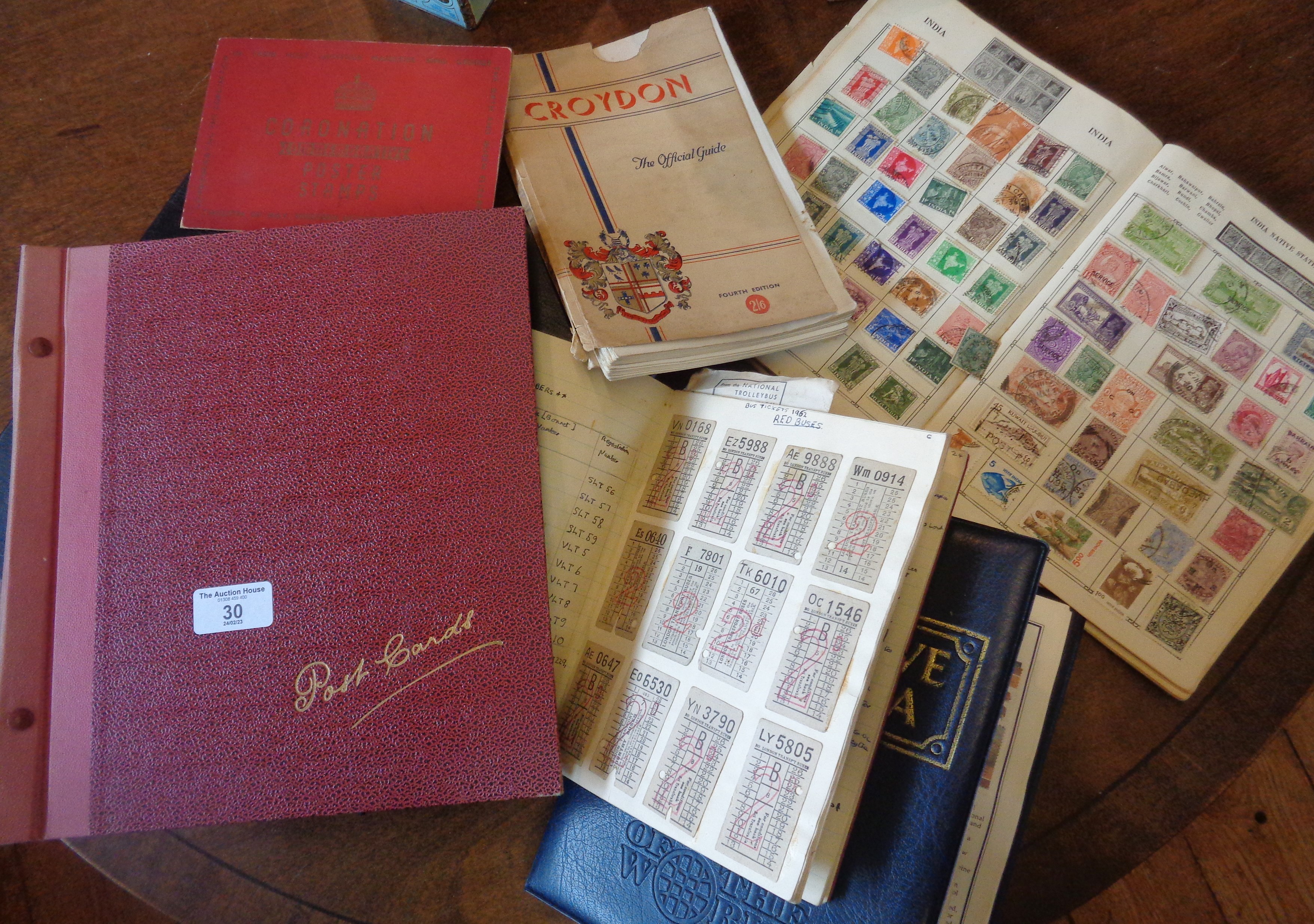 Two albums of postcards, commemorative stamps, a stamp album, etc.