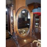 19th c. mahogany oval toilet mirror with carved supports
