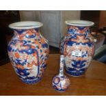 Pair of large Chinese Imari vases and a similar onion vase