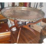 Large heavy Moroccan or Turkish incised copper tray (28" diameter) table with folding stand