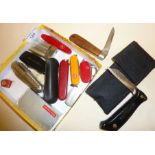 Various pen and pocket knives including Victorinox and a wooden handled WITNESS