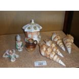 Four cameo carved shells, miniature stoneware Doulton jug with hallmarked silver rim, pincushion