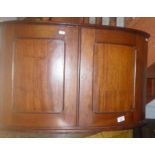 Mahogany bow-fronted wall hung cupboard